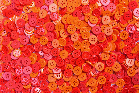 Red and orange buttons (clasper) for decoration and background.
