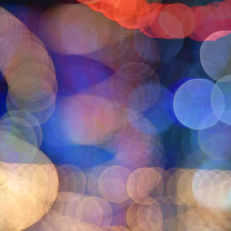 Defocused bokeh lights in blur night background.