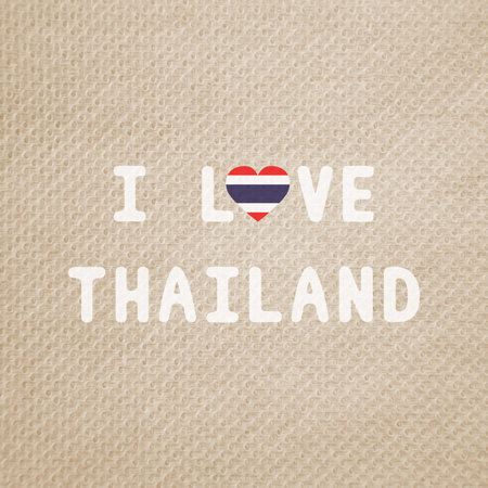 Love Thailand text on brown tissue pattern background.の写真素材