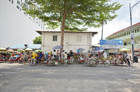 GEORGE TOWN, PENANG, MALAYSIA - JULY 30, 2015 : Trishaw vintage style waiting for service tourists...