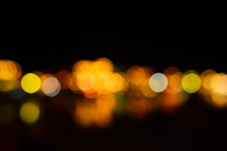 Colorful defocused bokeh lights in blur night background.の写真素材