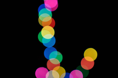 Colorful defocused bokeh lights in blur night background.の写真素材