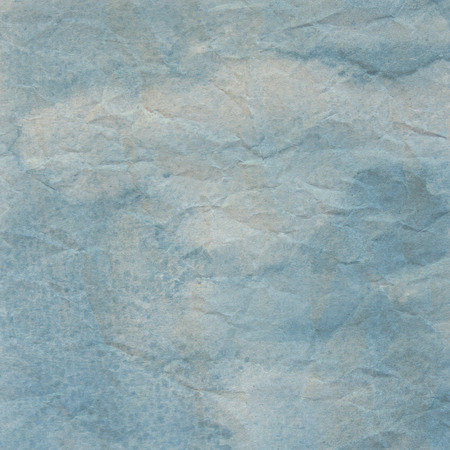 Blue crumpled paper for background.の写真素材