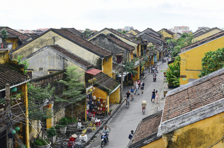 HOI AN, VIETNAM - NOVEMBER 24, 2016: Tourists visit Hoi An ancient town. Hoi An is a popular tourist destination of Asia. Hoi An is recognized as a World Heritage Site by UNESCO.のeditorial素材