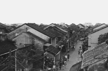 HOI AN, VIETNAM - NOVEMBER 24, 2016: Tourists visit Hoi An ancient town. Hoi An is a popular tourist destination of Asia. Hoi An is recognized as a World Heritage Site by UNESCO. Black and white.のeditorial素材