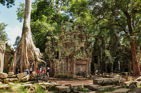 SIEM REAP, CAMBODIA - AUGUST 10: Unidentified tourists visit Ta Prohm temple on August 10, 2014 in Siem Reap, Cambodia.のeditorial素材