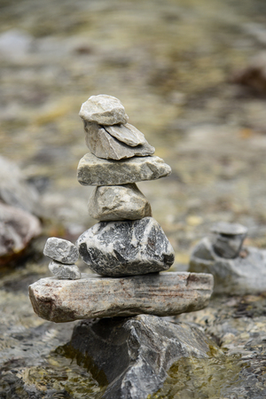 Stack of balance stones in the river at Yading, Daocheng county, Sichuan province, China.の写真素材