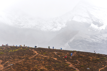 DAOCHENG, SICHUAN , CHINA - OCTOBER 14, 2017 : Unidentified people hiking at Yading Nature Reserve in Daocheng county, Sichuan province, China.のeditorial素材