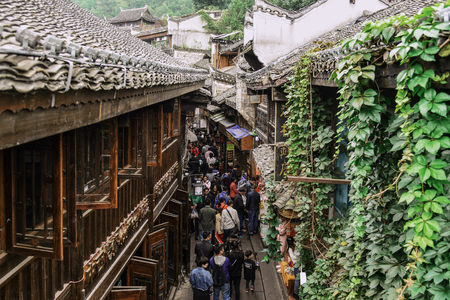 FENGHUANG, HUNAN, CHINA - OCTOBER 06, 2017: Unidentified tourists at The Old Town of Phoenix (Fenghuang Ancient Town). The popular tourist attraction which is located in Fenghuang County, HuNan, China.のeditorial素材