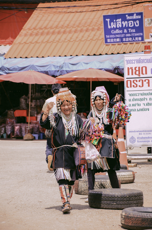 CHIANG RAI, THAILAND - SEPTEMBER 17, 2016 : Unidentified hill tribe women selling traditional souvenir products at local market at Doi Mae Salong in Chiang Rai, Thailand.のeditorial素材