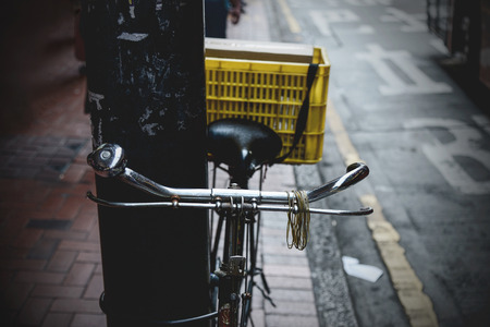 Old bicycle of newspaper man. Vintage color toned.の写真素材