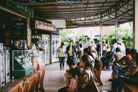 POIPET-BANTEAY MEANCHEY, CAMBODIA - JULY 11, 2018 : People waiting the bus at Free Shuttle bus station in Poipet, Banteay Meanchey, Cambodia.のeditorial素材