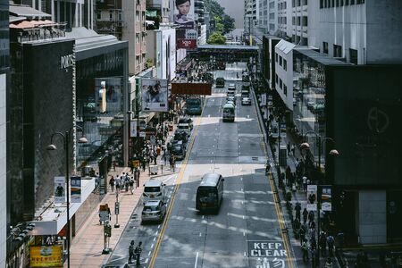 HONG KONG - APRIL 01, 2018 : Street photography of people and vehicles on Canton Road in Tsim Sha Tsui, Hong Kong.のeditorial素材