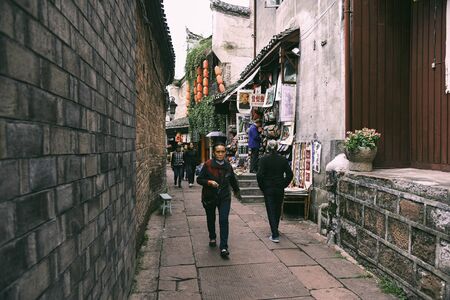 FENGHUANG, HUNAN, CHINA - OCTOBER 05, 2017: Unidentified tourists at The Old Town of Phoenix (Fenghuang Ancient Town). The popular tourist attraction which is located in Fenghuang County, HuNan, China.のeditorial素材