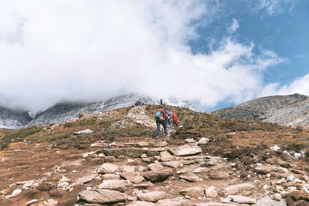 DAOCHENG, SICHUAN , CHINA - OCTOBER 14, 2017 : Unidentified people hiking at Yading Nature Reserve in Daocheng county, Sichuan province, China.のeditorial素材