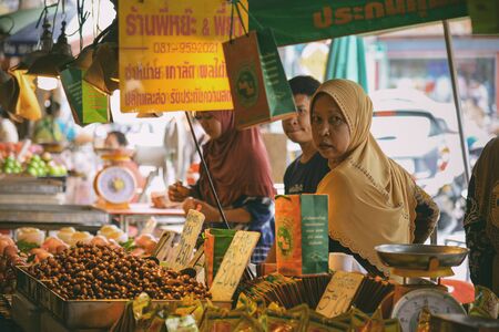 SONGKHLA, THAILAND - JANUARY 29, 2018: Unidentified merchant selling chestnuts at Kim Yong market in Hat Yai, Songkhla, Thailand.のeditorial素材