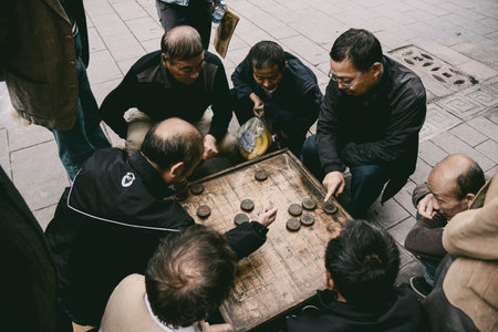 FENGHUANG, HUNAN, CHINA - OCTOBER 06, 2017: Chinese men playing Xiangqi in Fenghuang Ancient Town, Hunan Province, China.のeditorial素材