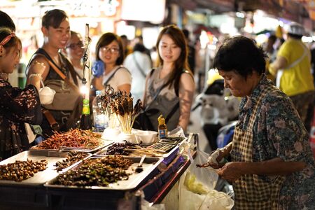 CHINATOWN, BANGKOK, THAILAND - 14 OCTOBER, 2018 : People are buying fried insects at Yaowarat(Chinatown) in Bangkok, Thailand.のeditorial素材