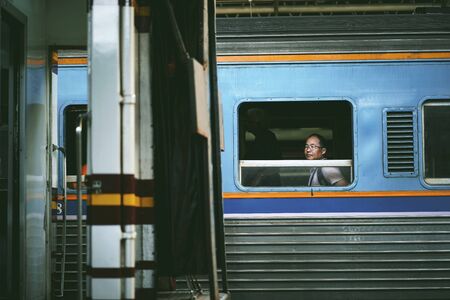 BANGKOK, THAILAND - OCTOBER 16, 2018 : Unidentified tourists on a train at Bangkok Railway Station(Hua Lamphong) in Bangkok, Thailand.のeditorial素材