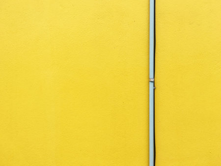 Pipe on yellow wall, Minimal style.