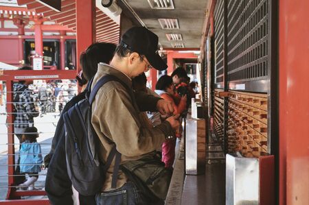 TOKYO, JAPAN - APRIL 05 : Tourists visit Sensoji temple on April 05, 2014 in Tokyo, Japan. Sensoji temple is the most famous attraction in Asakusa.のeditorial素材
