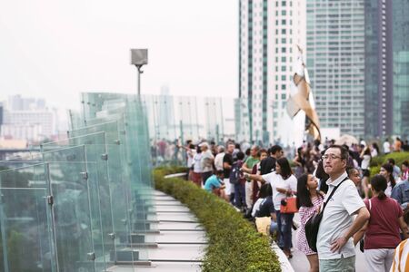 BANGKOK, THAILAND - DECEMBER 23, 2018 : People looking at view of buildings and Chao Phraya river from ICONSIAM department store in Bangkok, Thailand.のeditorial素材