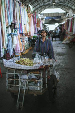 SAKAEO, THAILAND - JANUARY 08, 2019 : Unidentified woman selling fruits at Rong Kluea market on...