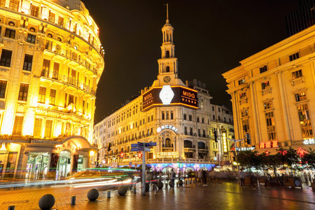 SHANGHAI, CHINA - MAY 18, 2019: People walking near Shanghai Fashion Store on Nanjing Road in Shanghai, China.のeditorial素材