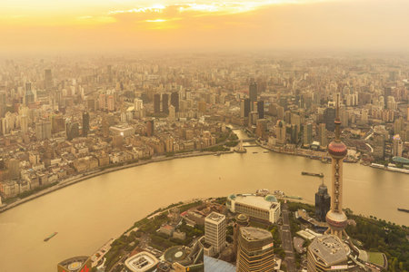 SHANGHAI, CHINA - MAY 20, 2019: Shanghai skyline and Huangpu river with sunset glow in Shanghai,...