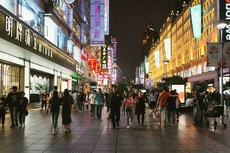 SHANGHAI, CHINA - MAY 18 : People walking on Nanjing Road at night on MAY 18, 2019 in Shanghai. Nanjing Road is one of the world's busiest shopping streets.のeditorial素材