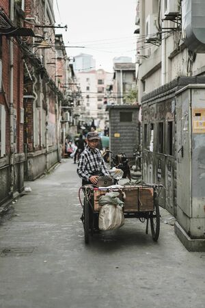 SHANGHAI, CHINA - MAY 18, 2019 : Unidentified man is relaxing in Hongkou District of Shanghai, China.のeditorial素材