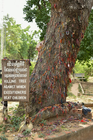 PHNOM PENH, CAMBODIA - JULY 08 : The killing tree which the Khmer Rouge threw the baby at Choeung Ek Killing Fields in Phnom Penh, Cambodia.のeditorial素材
