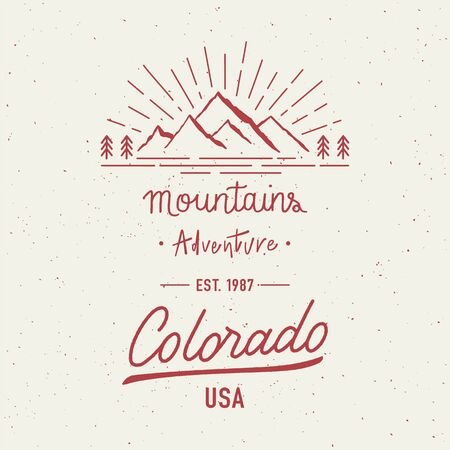 Mountain adventure and Colorado hand lettering with abstract watercolor splatters. Badge and label. Travel concept with mountains.のイラスト素材