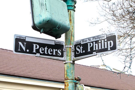 New Orleans, LA - March 27, 2016: A closeup of the street signs on the corner of Rue N. Peters and St. Philip in the heart of downtown New Orleans.のeditorial素材