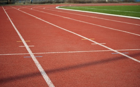 Red athletic track with line の写真素材