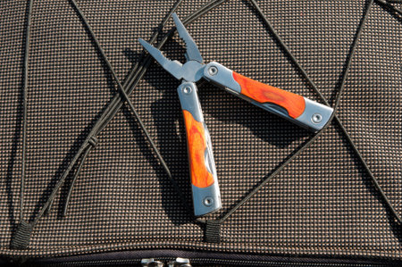 Multitool on travel pack background