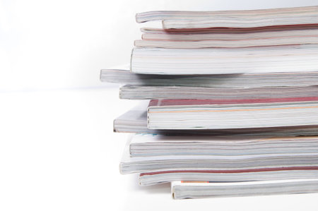 Stack of magazines on white
