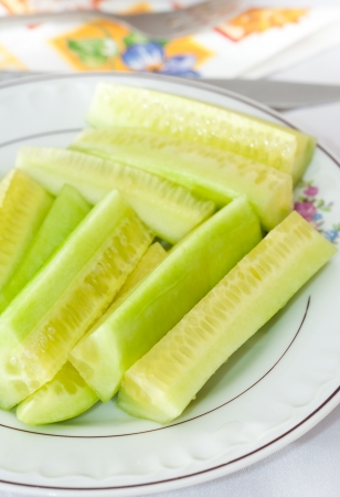cucumbers cut up on the plateの写真素材