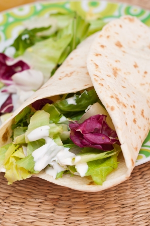 Chicken and vegetables wrapped in tortillaの写真素材