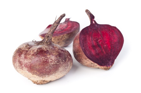 a few red beets on the white backgroundの写真素材