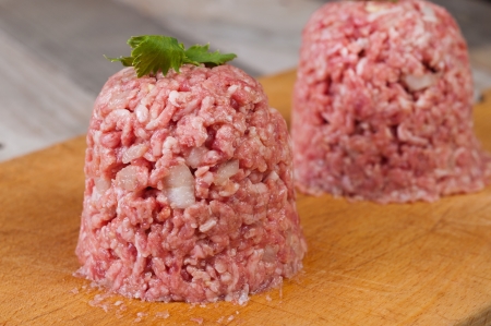 minced meat, steak tartare on the boardの写真素材