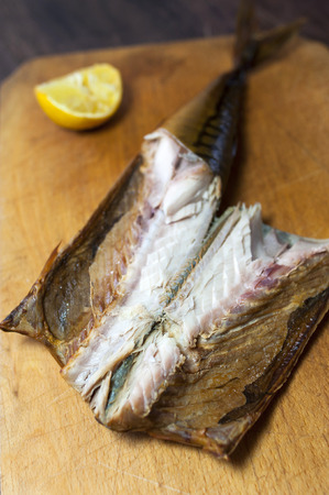 Smoked mackerel on kitchen background - studio shotの写真素材