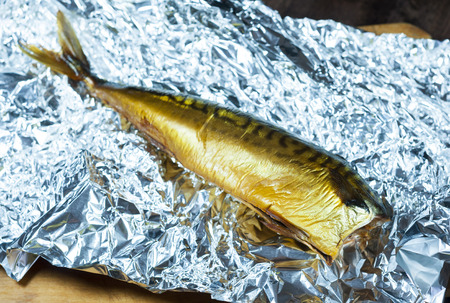 Smoked mackerel on kitchen background - studio shotの写真素材