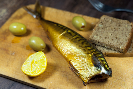 Smoked mackerel on kitchen background - studio shotの写真素材
