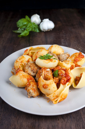 lumaconi pasta with meatballs in tomato sauce rusticaの写真素材