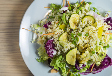Pearl barley salad with zucchini and colorful vegetablesの写真素材