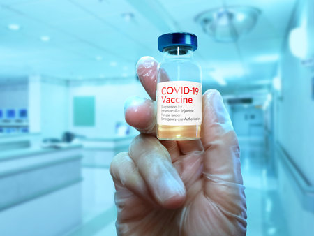 Hand of a doctor holding vaccine concept.