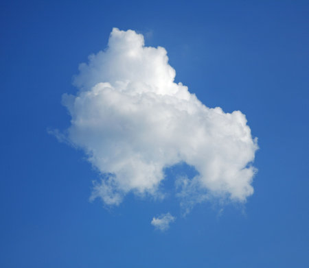 Lonely cumulus cloud in the blue sky