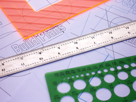 three drafting tools and plans