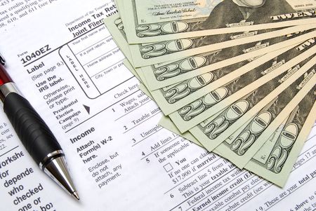 tax forms money and a penの写真素材